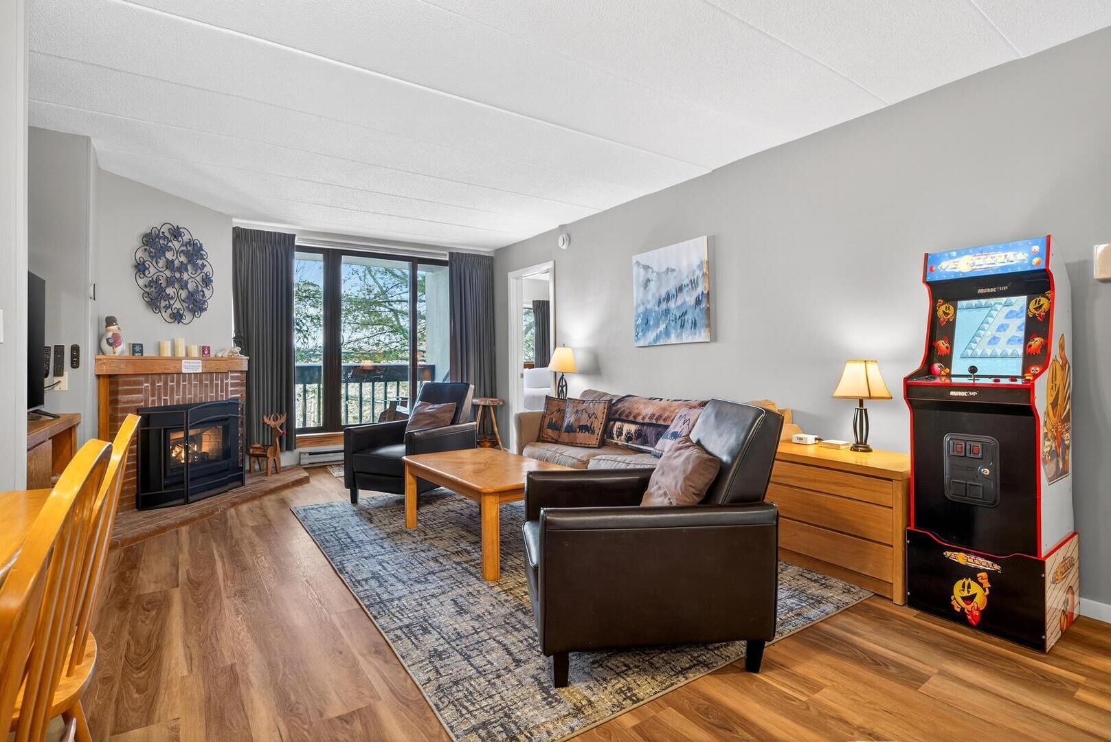 Condo, 1 King Bed with Sofa bed (Pinnacle E08) | Living area | Fireplace