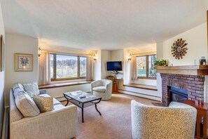 Condo, 1 Queen Bed with Sofa bed (Sunrise Cambridge 101) | Living area | Flat-screen TV, fireplace - Sunrise Cambridge 101 (Killington)