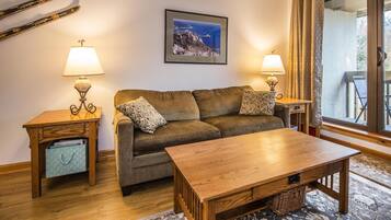 Condo, Multiple Beds (Pinnacle B20) | Living room | Flat-screen TV, fireplace, toys