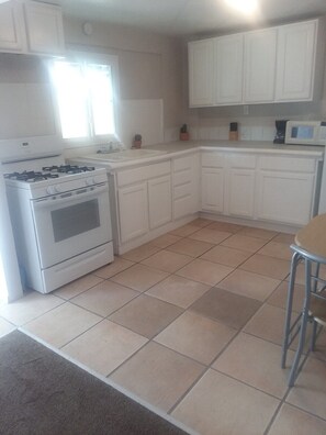 House (Cozy 1 br located on the west side of) | Private kitchen | Fridge, microwave, coffee/tea maker, cookware/dishes/utensils - Cozy 1 br Located on the West Side of Rio Grande (Albuquerque)