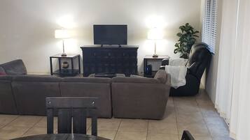 House (Spacious, homey 4-bedroom in Tucson) | Living room | TV