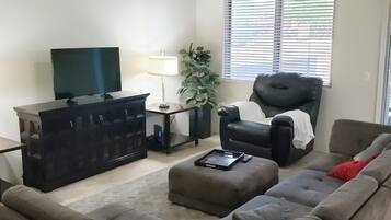 House (Spacious, homey 4-bedroom in Tucson) | Living room | TV