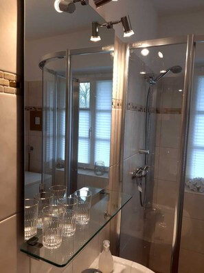 Shower, hair dryer, towels, soap