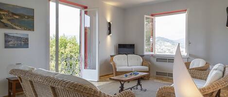 Apartment, 4 Bedrooms | Living area | Flat-screen TV