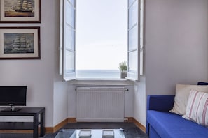 Departamento, 1 habitación | Área de sala de estar | Televisión de pantalla plana 