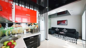 Apartamento Confort | Zona de estar | Televisión de pantalla plana de 40 pulgadas con canales por cable