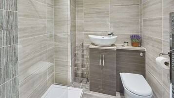 Shower, hair dryer, towels, soap
