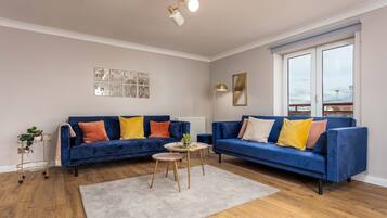 Classic Apartment | Living area | 22-inch Smart TV with satellite channels, TV, Netflix