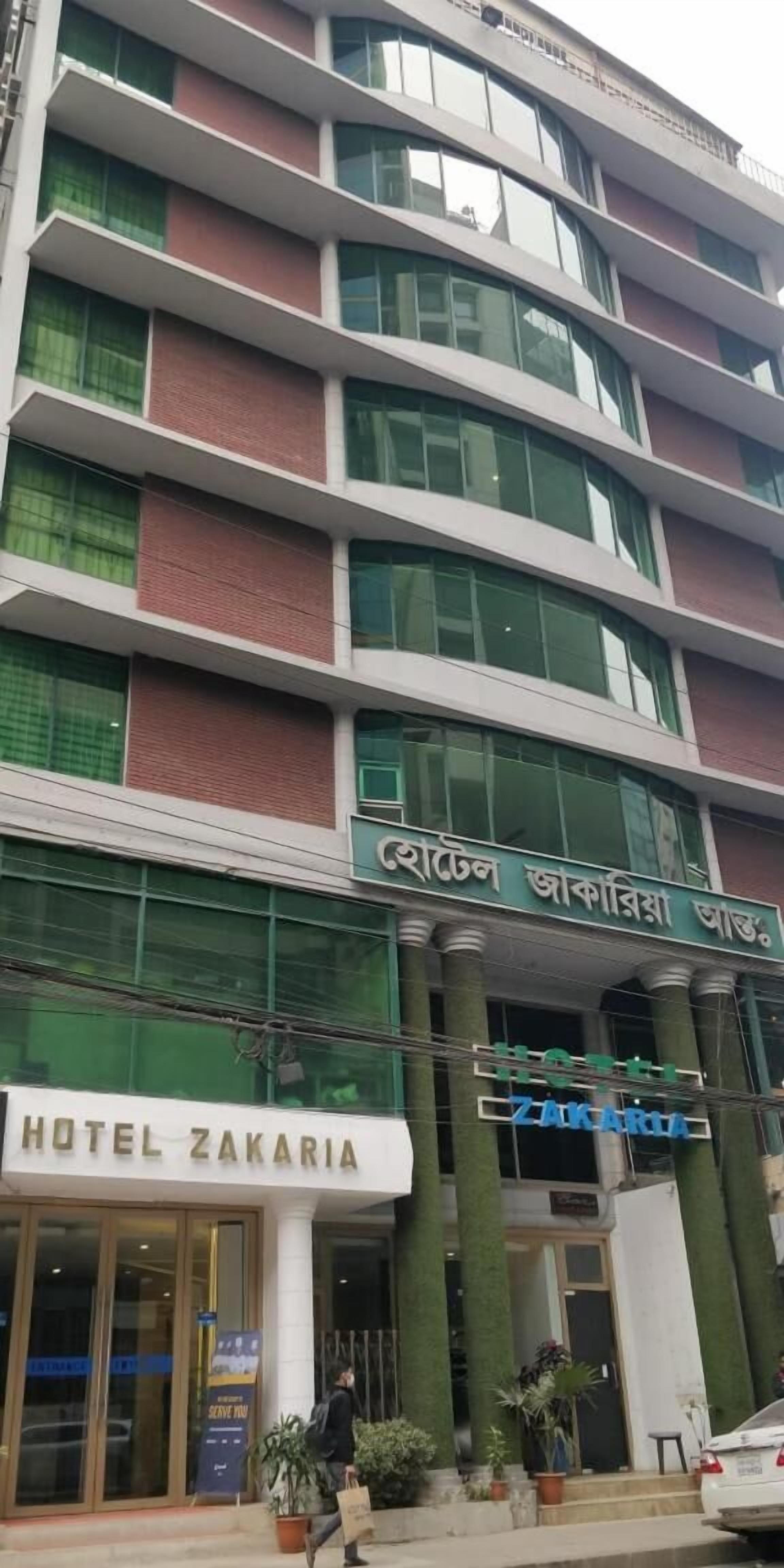 A multi-story building with a sign for Hotel Zakaria.