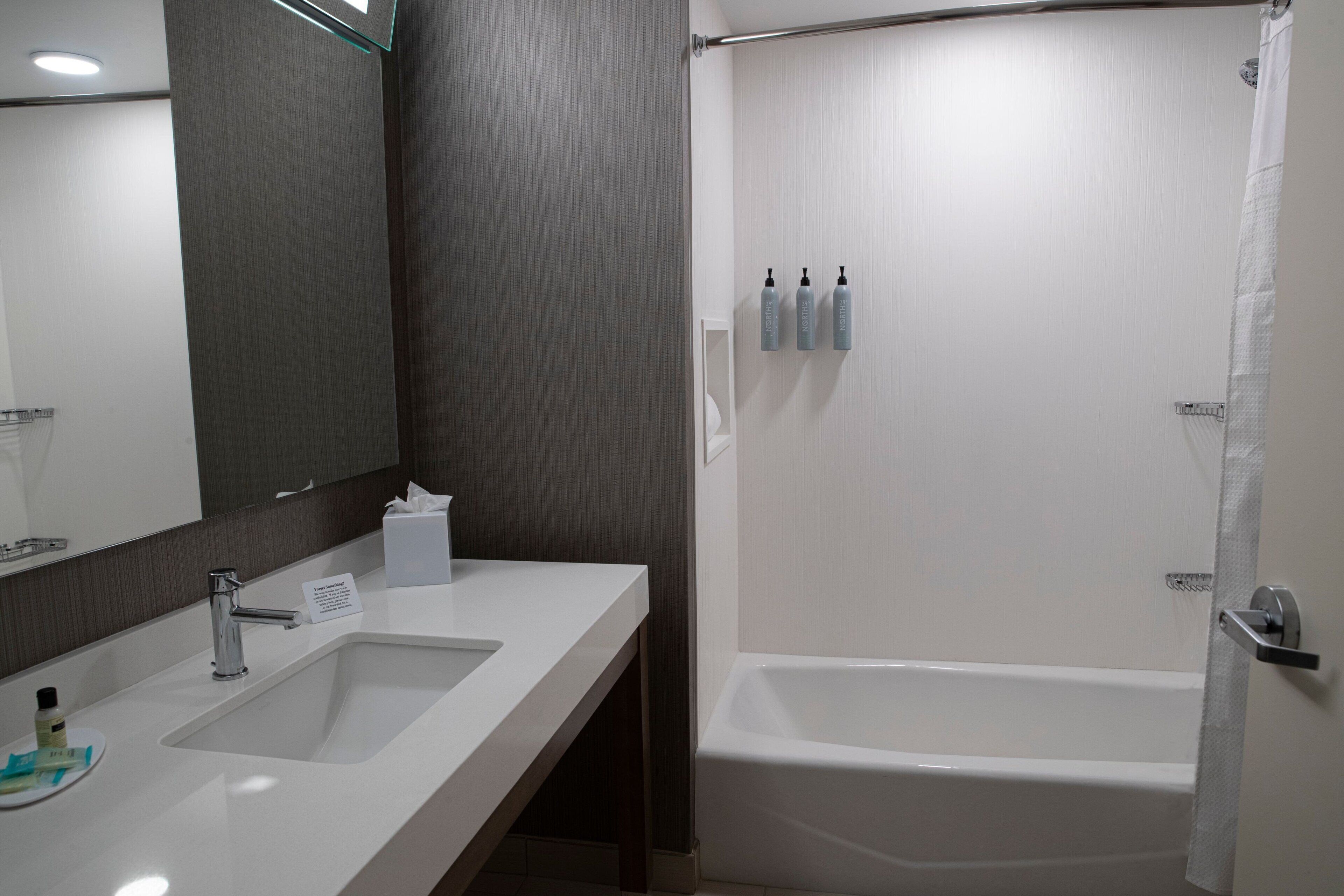 room, 2 queen beds | bathroom | free toiletries, hair dryer, towels