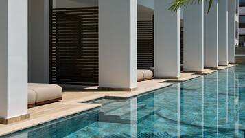 Seasonal outdoor pool, open 8:00 AM to 6:00 PM, pool umbrellas