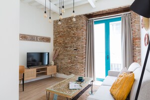 Premium Apartment, Balcony | Living area | Flat-screen TV