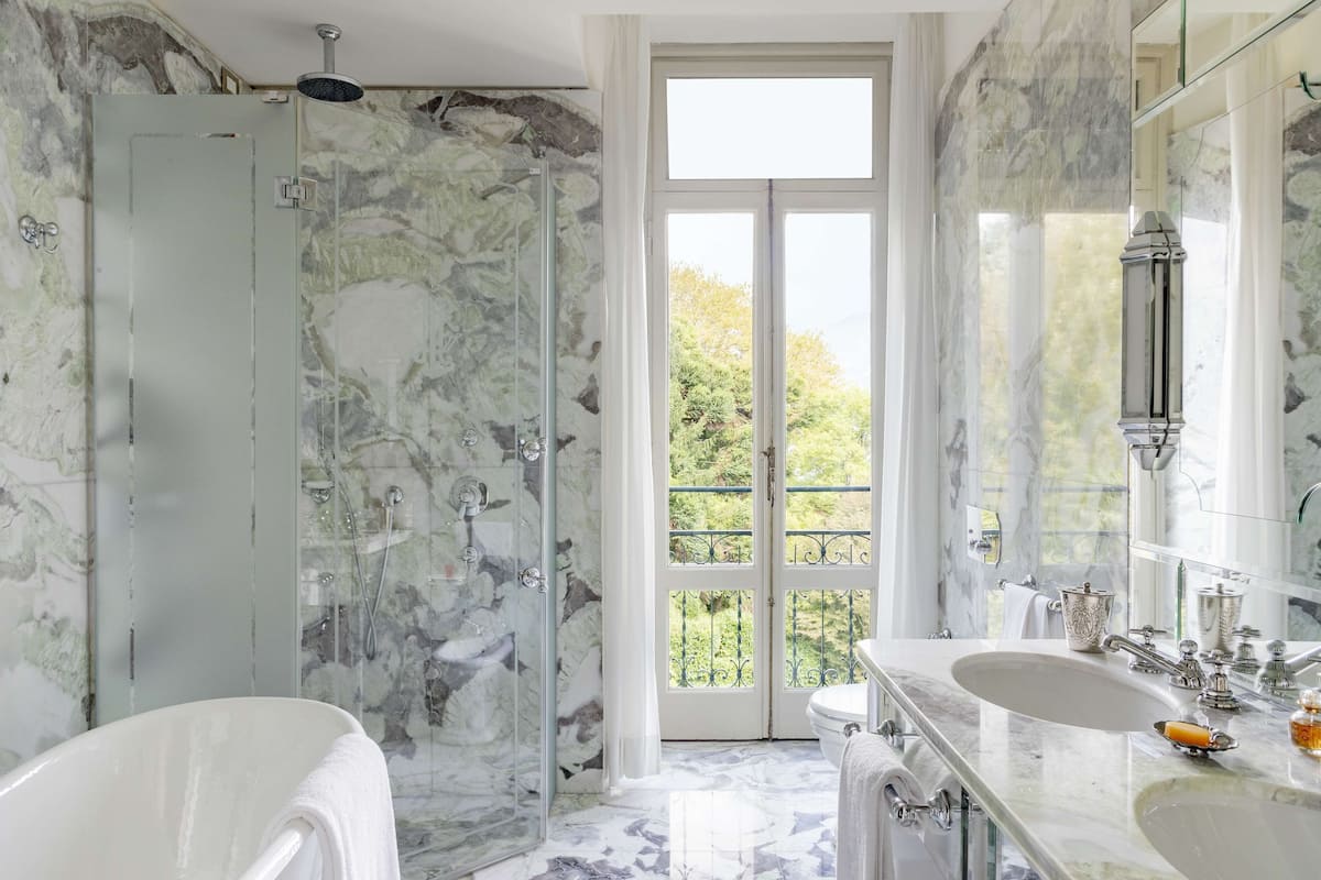 lake view deluxe room | bathroom | designer toiletries, hair dryer, bathrobes, slippers