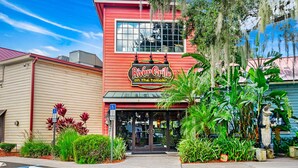 A red building with a sign that reads "River Grille on the Tomoka." - Latitude Change - Luxury Oceanfront Home (daytona beach)