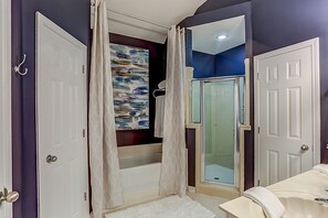 Bathtub, hair dryer, towels, soap