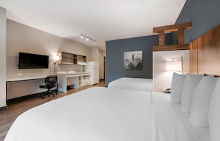 Premium bedding, desk, laptop workspace, iron/ironing board