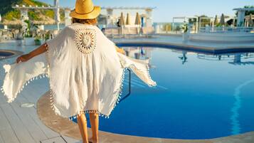 Indoor pool, open 10:00 AM to 8:00 PM, pool umbrellas, pool loungers