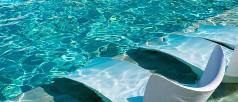 Indoor pool, open 10:00 AM to 8:00 PM, pool umbrellas, pool loungers