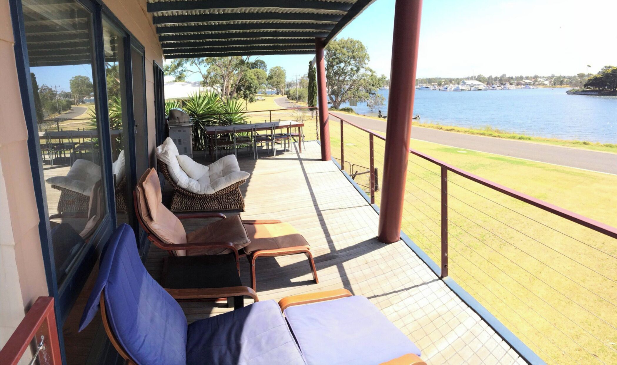 Large Balcony with 10 seater table and multiple relax chairs & big gas bbq