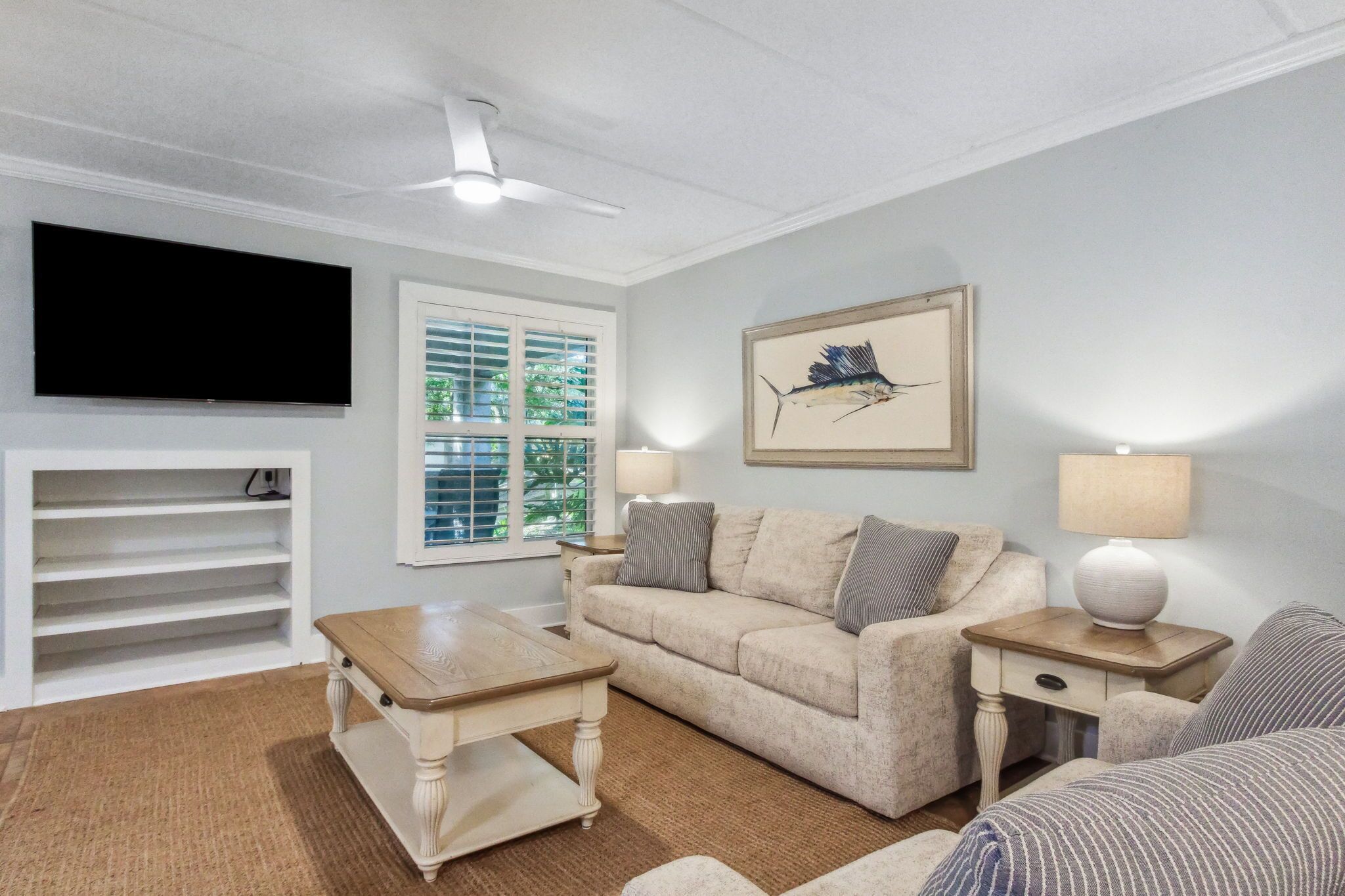 Living Area with Flat Screen TV and Sliding Glass Doors to Covered Patio