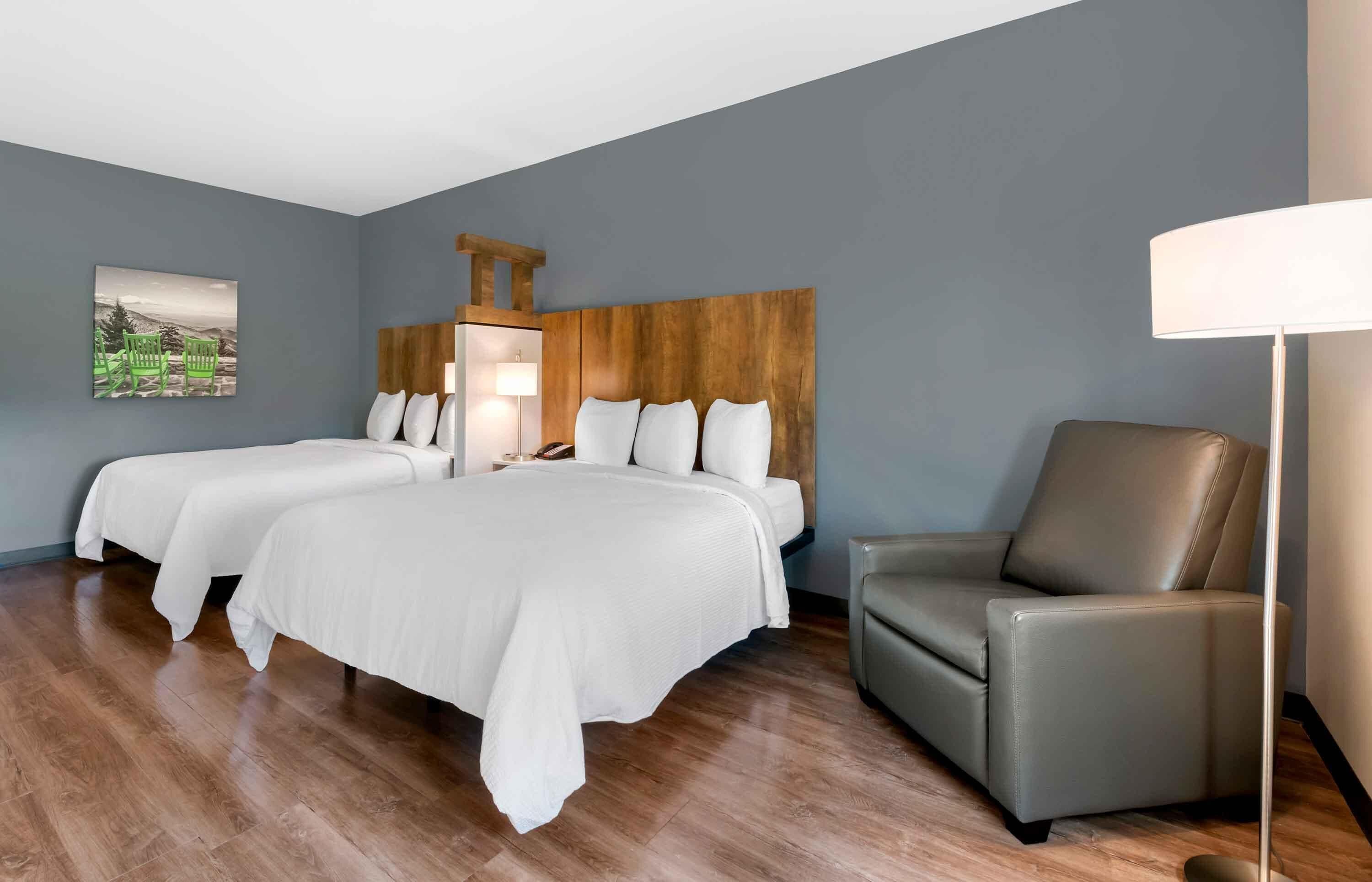 Premium bedding, desk, laptop workspace, iron/ironing board