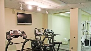 A gym with treadmills, elliptical machines, and a mirrored wall. - Silver Creek 1104  Studio Sleeps 3,  Slope Side (Snowshoe)