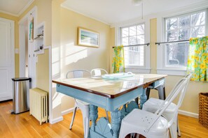 Enjoy a meal at the dining table with a view of the outdoors.
