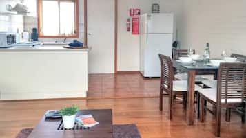Deluxe House | Living area | Flat-screen TV