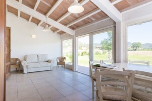 Apartment, 1 Bedroom (Mezzogiorno) | Living area | Flat-screen TV