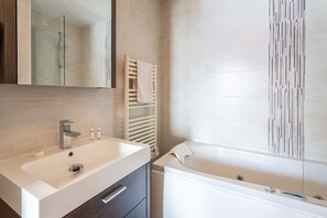 Combined shower/tub, hair dryer, towels, toilet paper