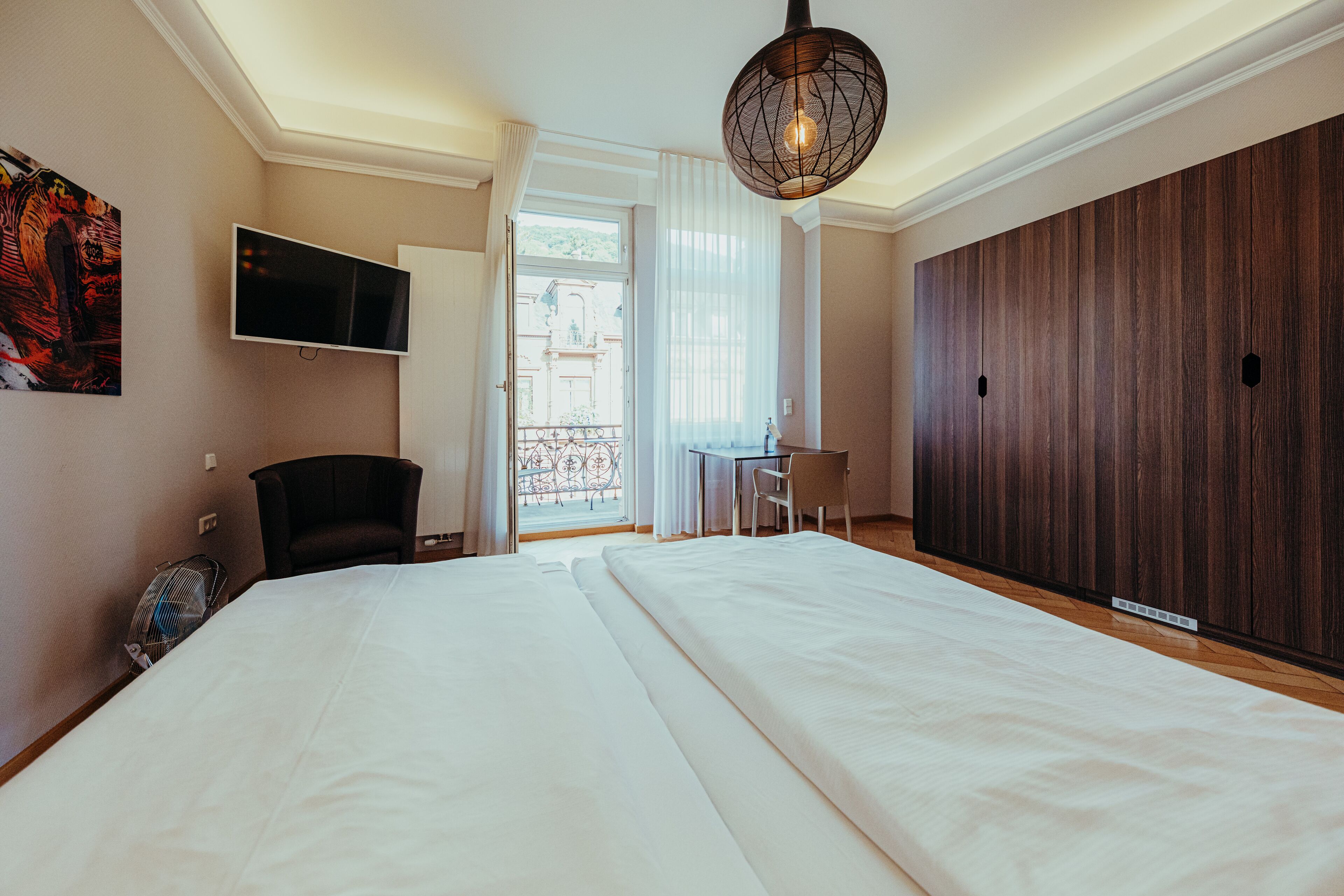 Hypo-allergenic bedding, desk, laptop workspace, blackout curtains