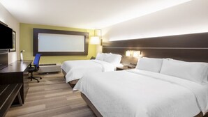 A hotel room with two beds, a desk, a chair, a TV, and a projector screen. - Holiday Inn Express & Suites Dallas Central Market Center by IHG (Dallas)