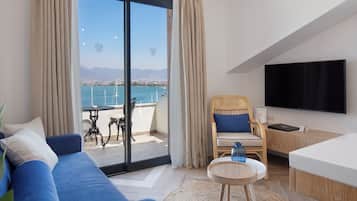 Deluxe Studio Suite, 1 Bedroom, Harbor View, Sea Facing | Living area | 52-inch LED TV with satellite channels, heated floors