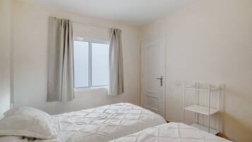 2 dormitorios, tabla de planchar con plancha, wifi gratis y ropa de cama