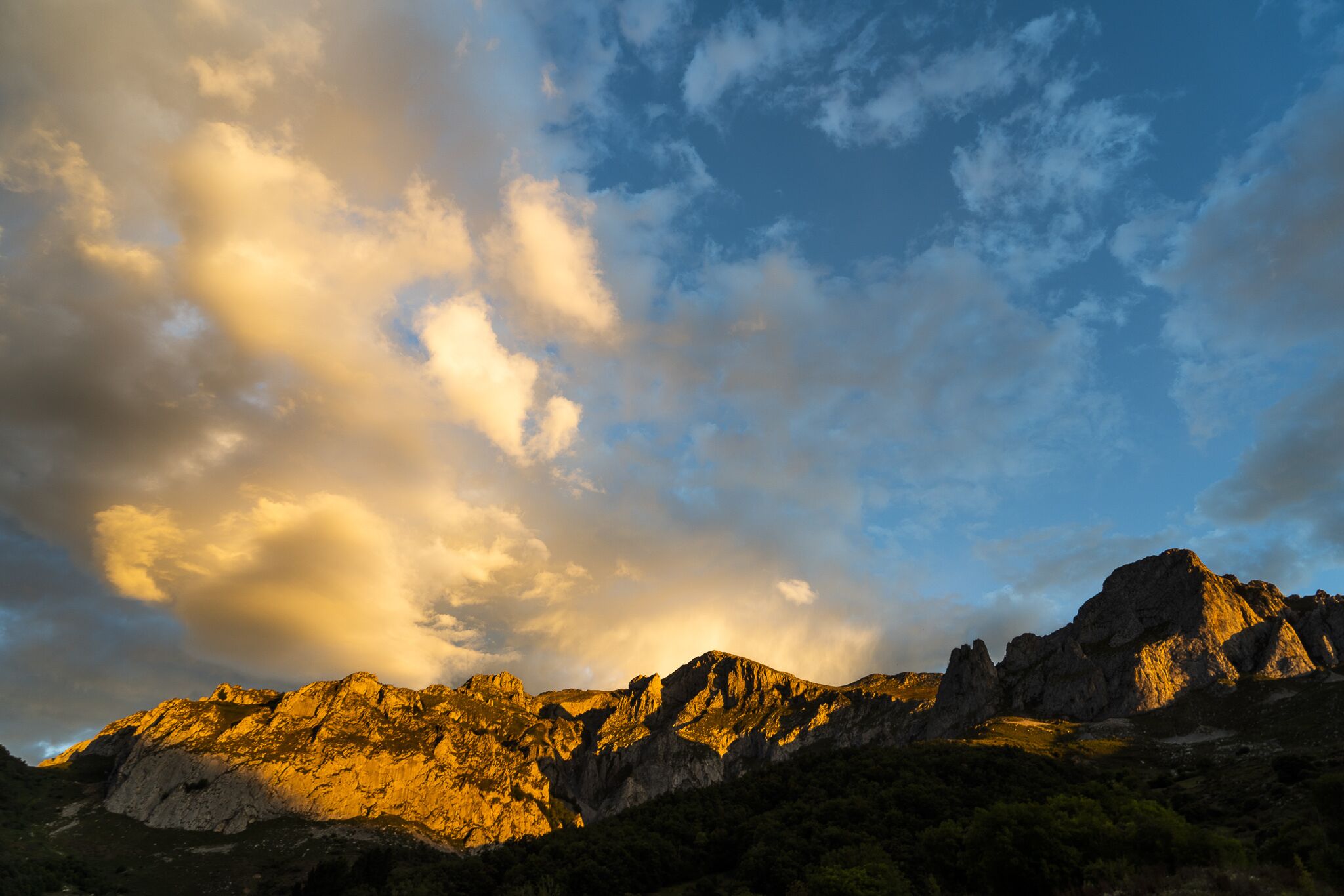 A mountain range with rugged terrain and a clear sky.