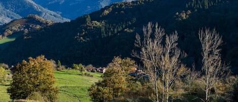 A mountainous landscape with a small village nestled in the valley.