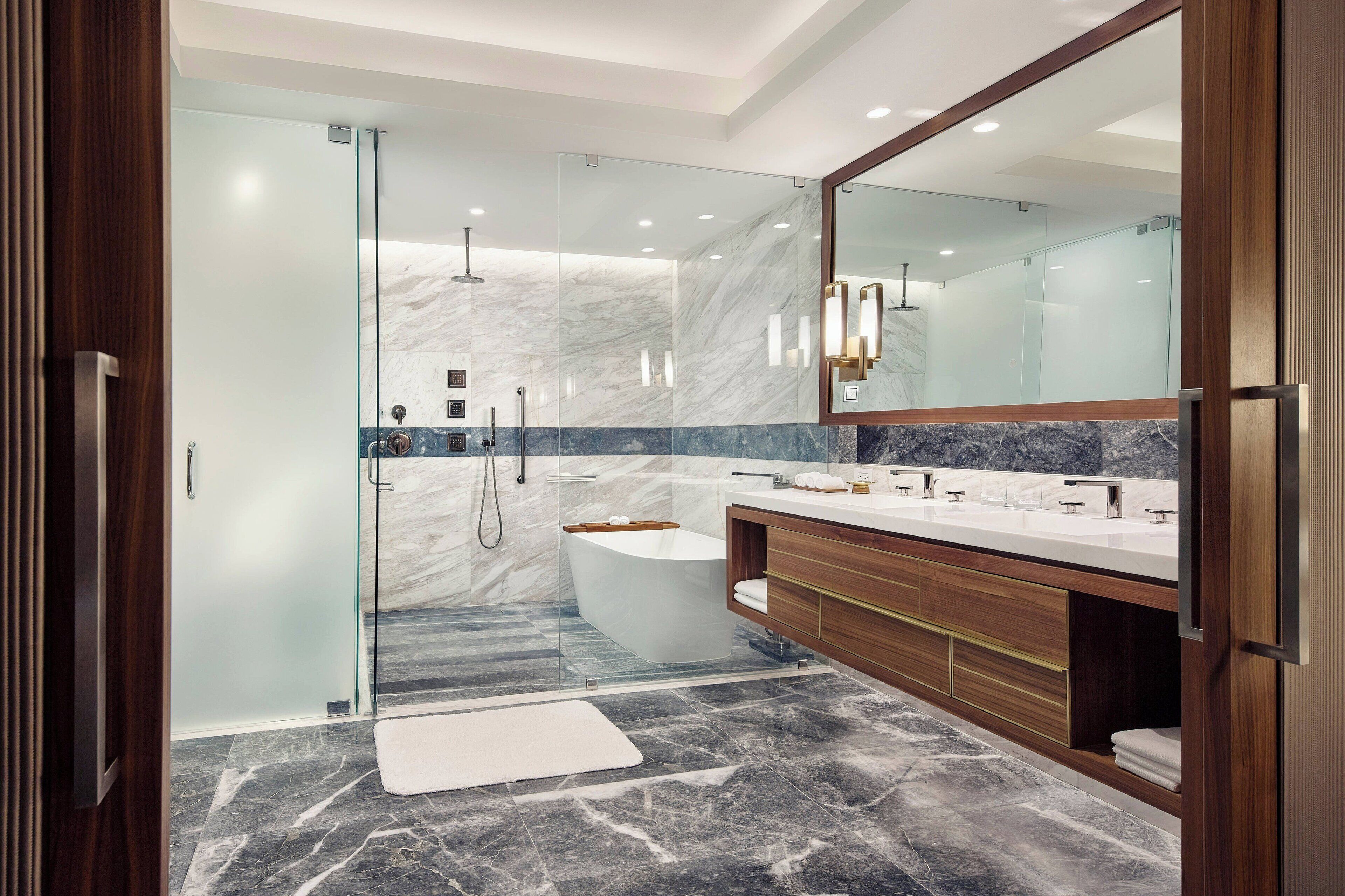 junior suite, 1 king bed, non smoking | bathroom | designer toiletries, hair dryer, bathrobes, slippers