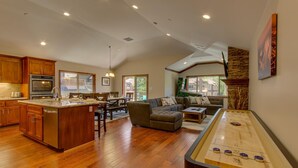 A spacious living area with a dining table, sofas, and a pool table. - Air Conditioning, Shuffleboard, Walk to Heavenly/ Casinos/ Lake, Grill, Wifi – Tahoe Woods Luxury (South Lake Tahoe)