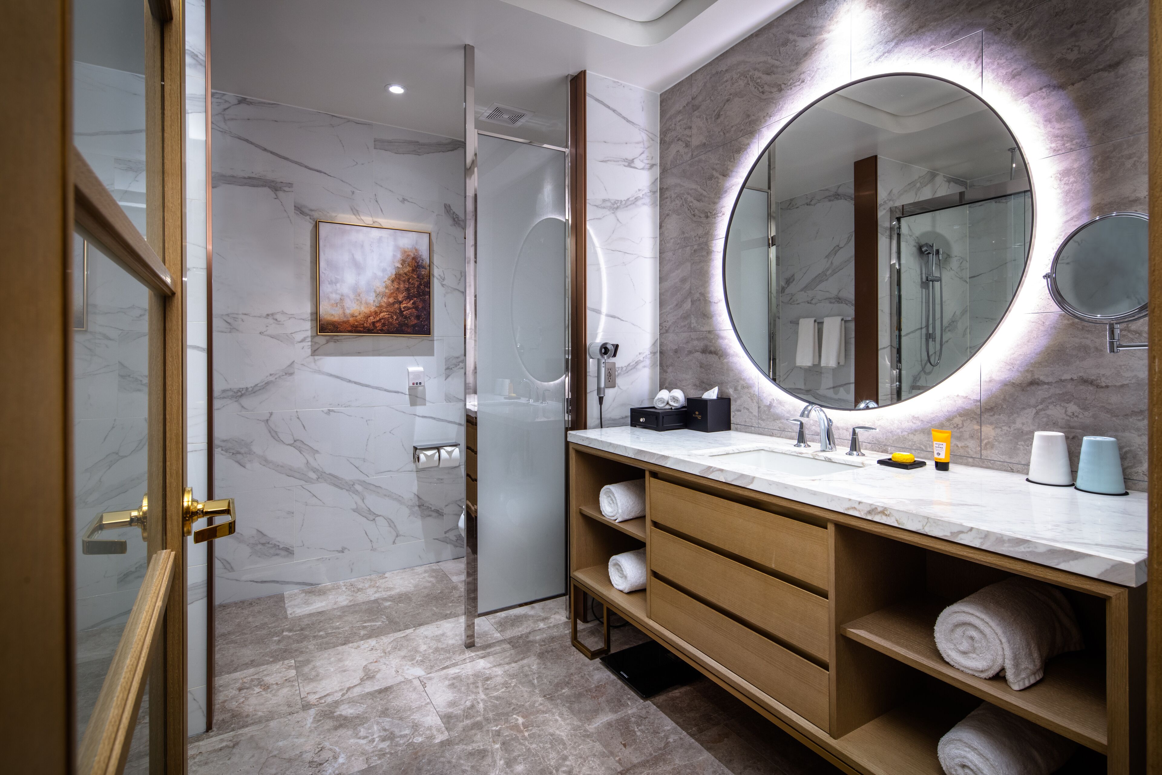 deluxe 2 queens one bedroom suite | bathroom | combined shower/bathtub, rainfall showerhead, designer toiletries
