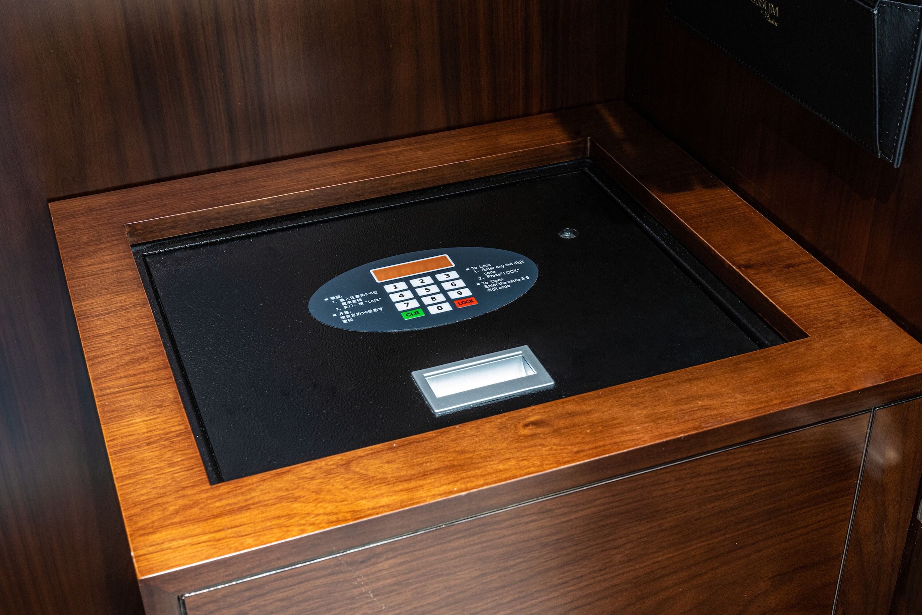 A wooden panel with a built-in electronic keypad.