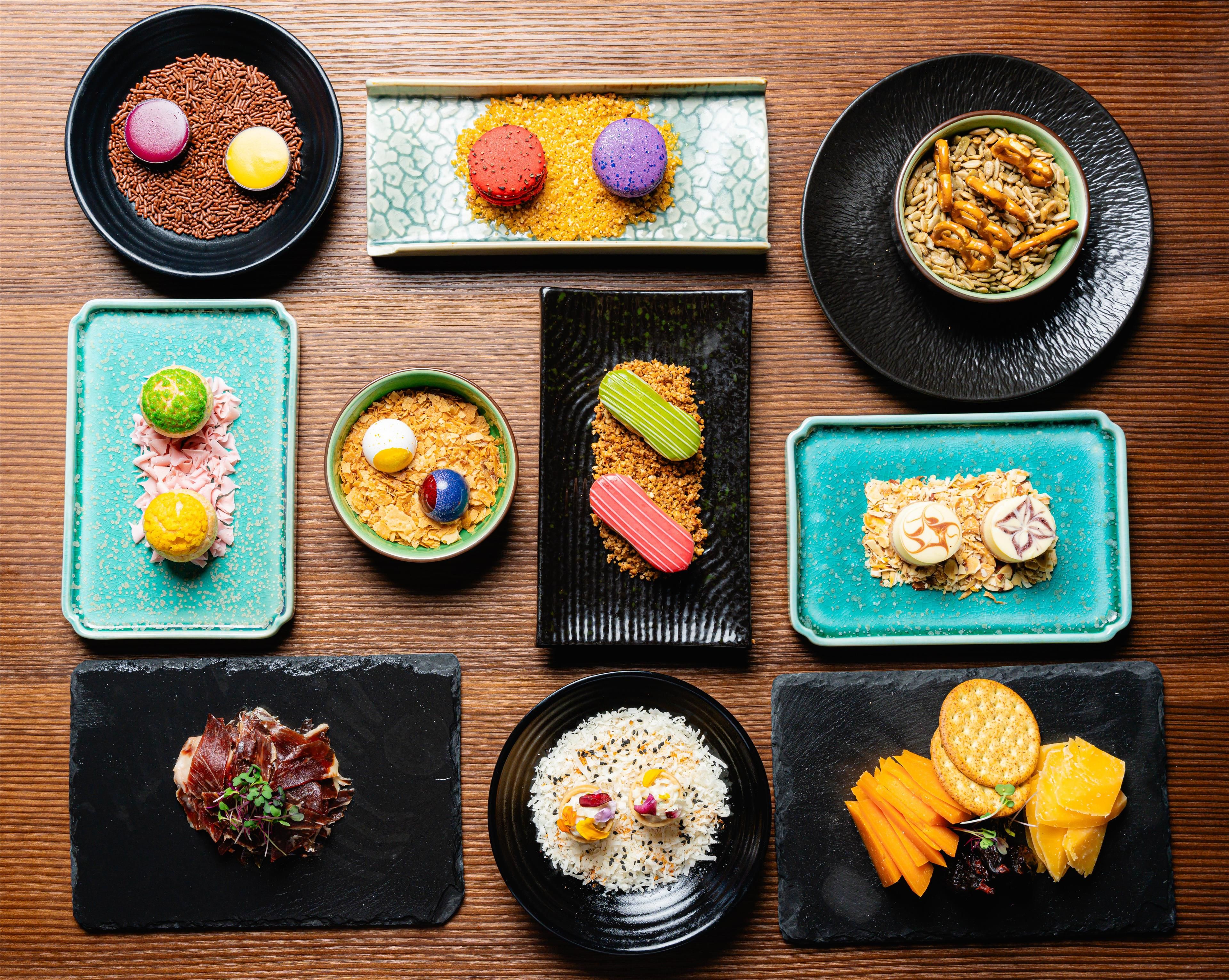 A variety of dishes arranged on different plates and bowls.