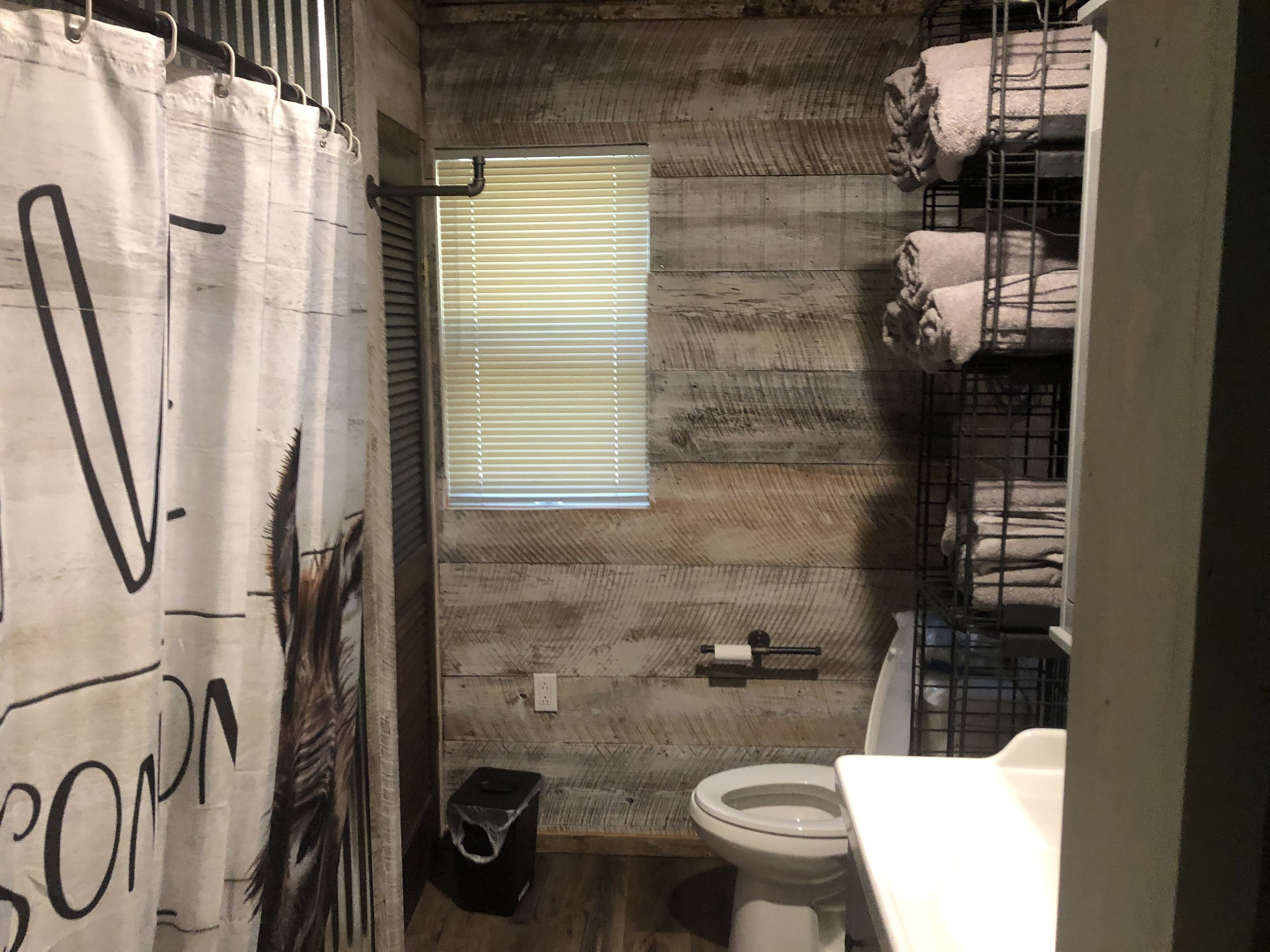 Cabin with 40 ft porch overlooking a pond. 