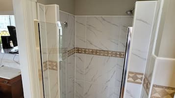 Bathtub, towels, soap, toilet paper