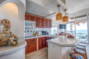 Fridge, microwave, stovetop, coffee/tea maker