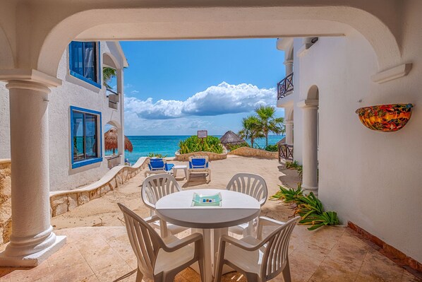 Outdoor dining - Ground-Floor Beachfront Condo with Pool & Daily Service (Akumal)