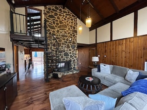 Living room with smart tv and wood burning fireplace 