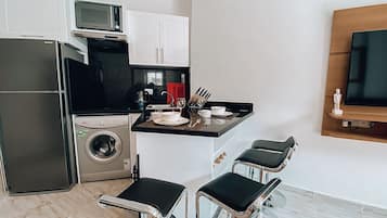 Fridge, microwave, oven, cookware/dishes/utensils