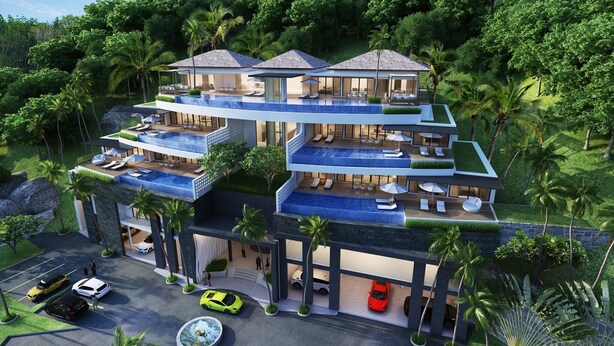 A multi-story resort with a pool on each level, surrounded by lush greenery. - Andamaya Surin Bay (Choeng Thale)