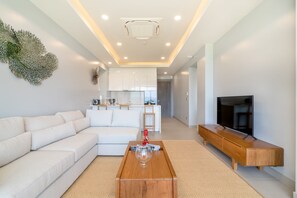 Classic Apartment (A6) | Living area | LCD TV - Andamaya Surin Bay (Choeng Thale)