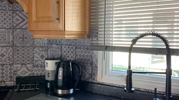 Cabin | Private kitchen | Fridge, microwave, oven, stovetop